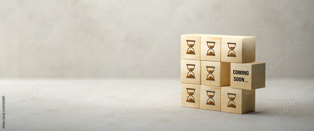 Wall mural cube with message coming soon on concrete background