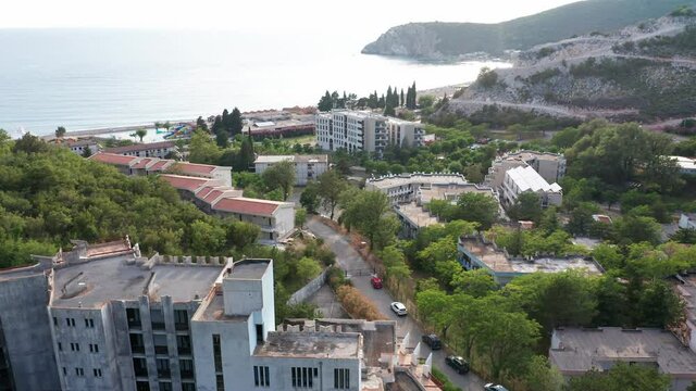 Canj Montenegro - seaside summer resort on the Adriatic coast, featuring long sandy beach and blue and turquoise crystal clear sea. Aerial footage.