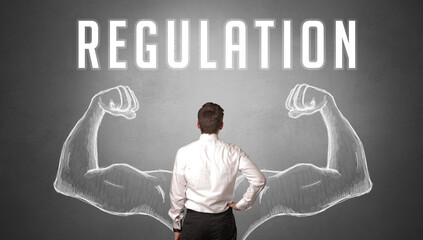 Rear view of a businessman with REGULATION inscription, powerfull business concept