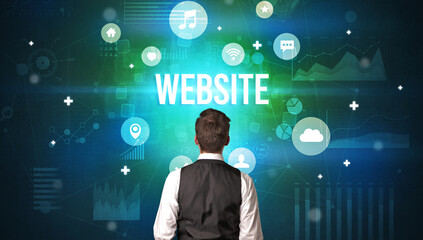 Rear view of a businessman with WEBSITE inscription, modern technology concept