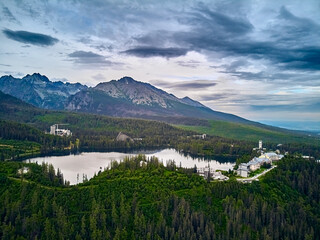 Fototapeta premium Panoramic view of mountain lake in National Park High Tatra. Strbske pleso, Slovakia, Europe. Beautiful world.