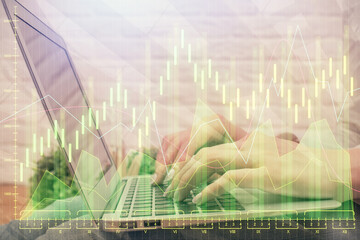 Multi exposure of woman hands typing on computer and forex chart hologram drawing. Stock market analysis concept.