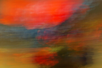 Fototapeta na wymiar Abstract colorful stripes and spots of light texture with a dark background. Slow shutter speed.