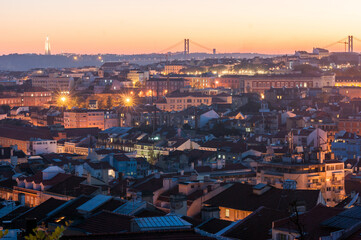 Sunset with orange tones from the Graça viewpoint in Lisbon, capital of Portugal