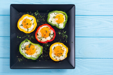 Yellow , red and green pepper with fried eggs