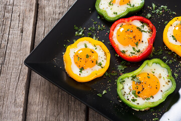 Yellow , red and green pepper with fried eggs