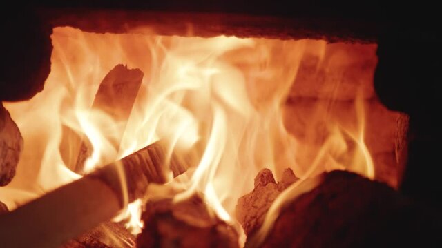 Slow motion flames close up in fire stove of Balinese home