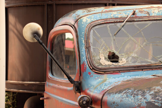 Old truck with a hole in the windscreen