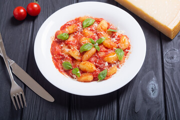 Italian homemade potatoes gnocchi with tomatoes sauce
