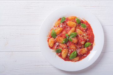 Italian homemade potatoes gnocchi with tomatoes sauce