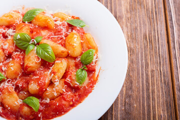 Italian homemade potatoes gnocchi with tomatoes sauce