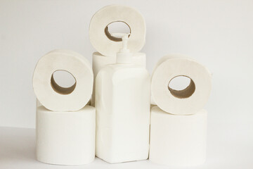 Clean toilet paper in stack on white with disinfectant.Close up taken
