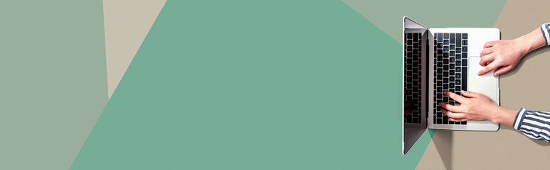 Person using a laptop computer from above