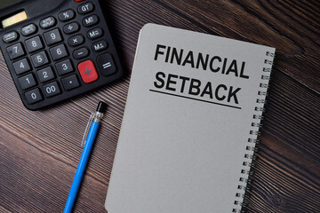 Book about Financial Setback isolated on wooden table.