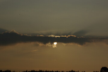 The sun in the clouds.