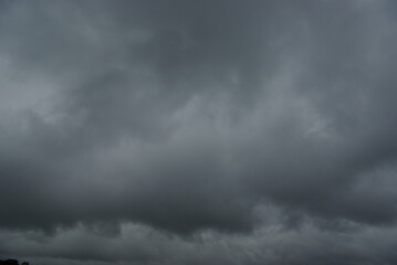 Dark clouds in an alarming sky.