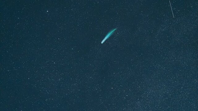 The falling comet on the starry sky background. hyper lapse