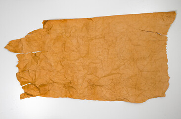 Old grunge paper texture.The texture of the paper is wet, old, yellowed with time. Torn, stained.
