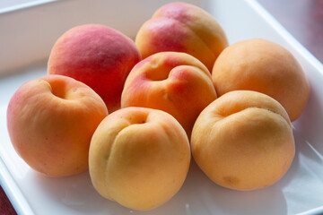 Apricots on a white tray