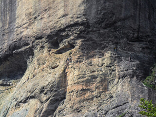 climbers doing one of the most classic routes in rio de janeiro, known as passing the eyes on the stone of the gavea, ( pedra da gavea ) rio de janeiro.