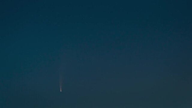 The flighting comet on the evening starry sky background