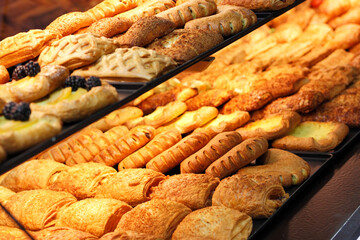 freshly baked pastries on a bakery shop counter