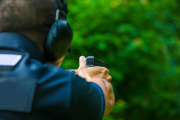 the man shooting with gun