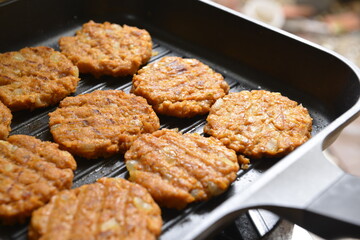 Homemade Cutlet Burger on cooking pan 