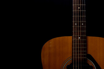 Obraz na płótnie Canvas Close up detail of orange acoustic guitar