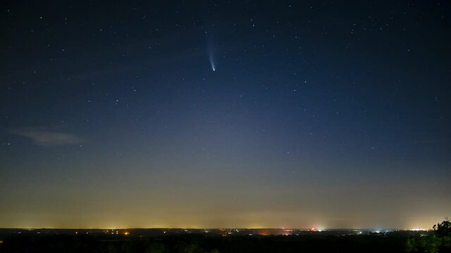 Neowise C 2020 F3 Comet Timelapse over fields and night starry sky.