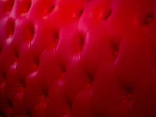 Background from leather of cushion. Red leather from retro chairs. The seat has a vintage style