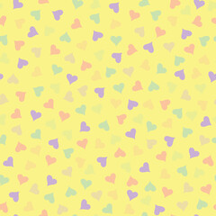 Pastel yellow and multicolor heart theme seamless repeating pattern.