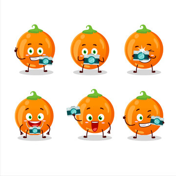 Photographer profession emoticon with halloween orange candy cartoon character