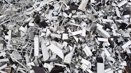 Pile of aluminium frames residue in a furniture workshop for recycling