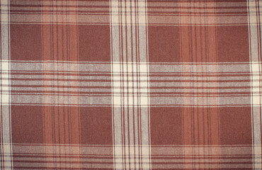 Brown and white tablecloth as background texture. Copy space for text