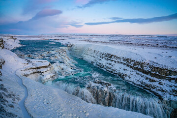 Gullfoss Waterfall in golden circle,  Iceland, in winter time, at sunset.
