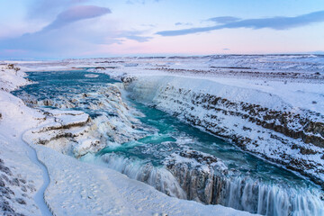 Gullfoss Waterfall in golden circle,  Iceland, in winter time, at sunset.
