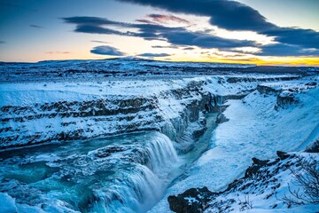 Gullfoss Waterfall in golden circle,  Iceland, in winter time, at sunset.
