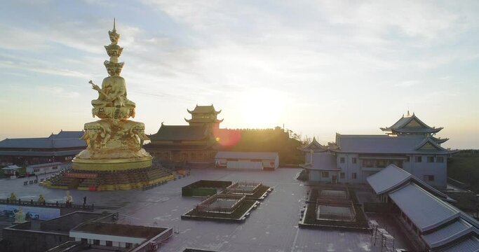 Aerial view of Emei Jinding in the morning sunrise at Sichuan China UNESCO World Heritage site backlight 4k drone footage