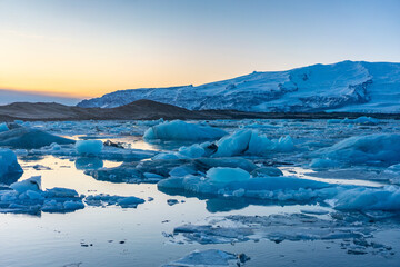 Fototapeta na wymiar Jokulsarlon, the glacier lake in Iceland, shot in winter time, at sunset.