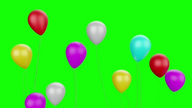 Colorful party balloons flying with green background
