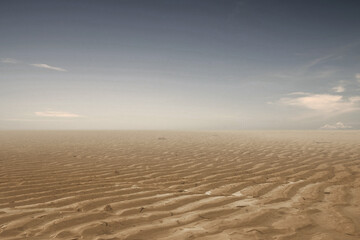 Drought land with a dark sky background
