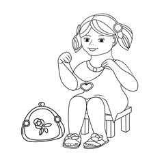 A little girl tries on a pendant. There is a cosmetic bag nearby. Vector black and white outline illustration. Coloring book page.