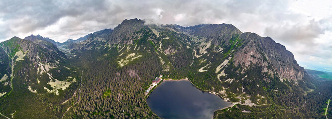 Fototapeta na wymiar Beautiful panoramic view of Popradske pleso (once called Rybie pleso) is a mountain lake of glacial origin located in the High Tatras, northern Slovakia, Europe. Beautiful world.