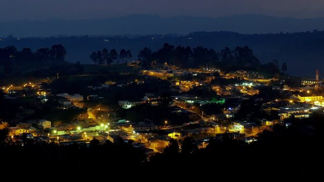 Time-lapse you see in the small town of Salento in Colombia during the sunset that gives way to the night, where the blue skies become dark as the lights of the small town illuminate the image