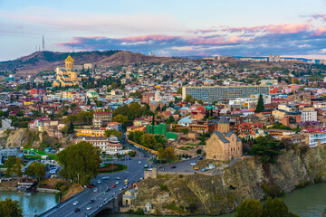 Panorama view of city Tbilisi, the capital in Georgia, at sunset.