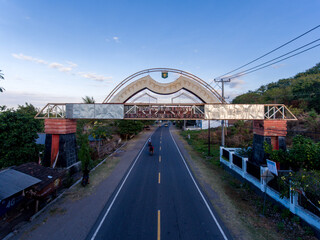 Welcome gate of Sumbawa Besar City with main road underneath