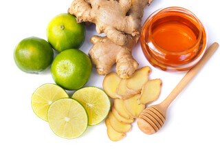 Fototapeta na wymiar Ingredients for juice drinks or tea with honey, lime lemon and ginger