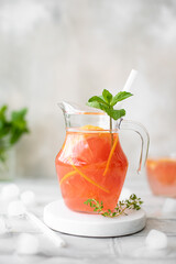 freshly squeezed citrus juice with pieces of grapefruit and mint