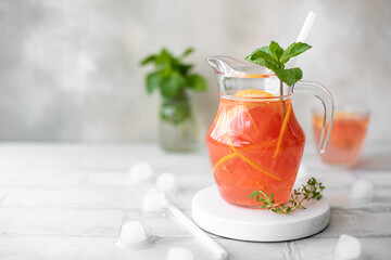 freshly squeezed citrus juice with pieces of grapefruit and mint